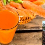 Carrot juice on wooden background